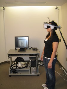 A fully immersive environment. The user is in a head-mounted display (HMD) and can only see the virtual world, which changes naturally as she moves.